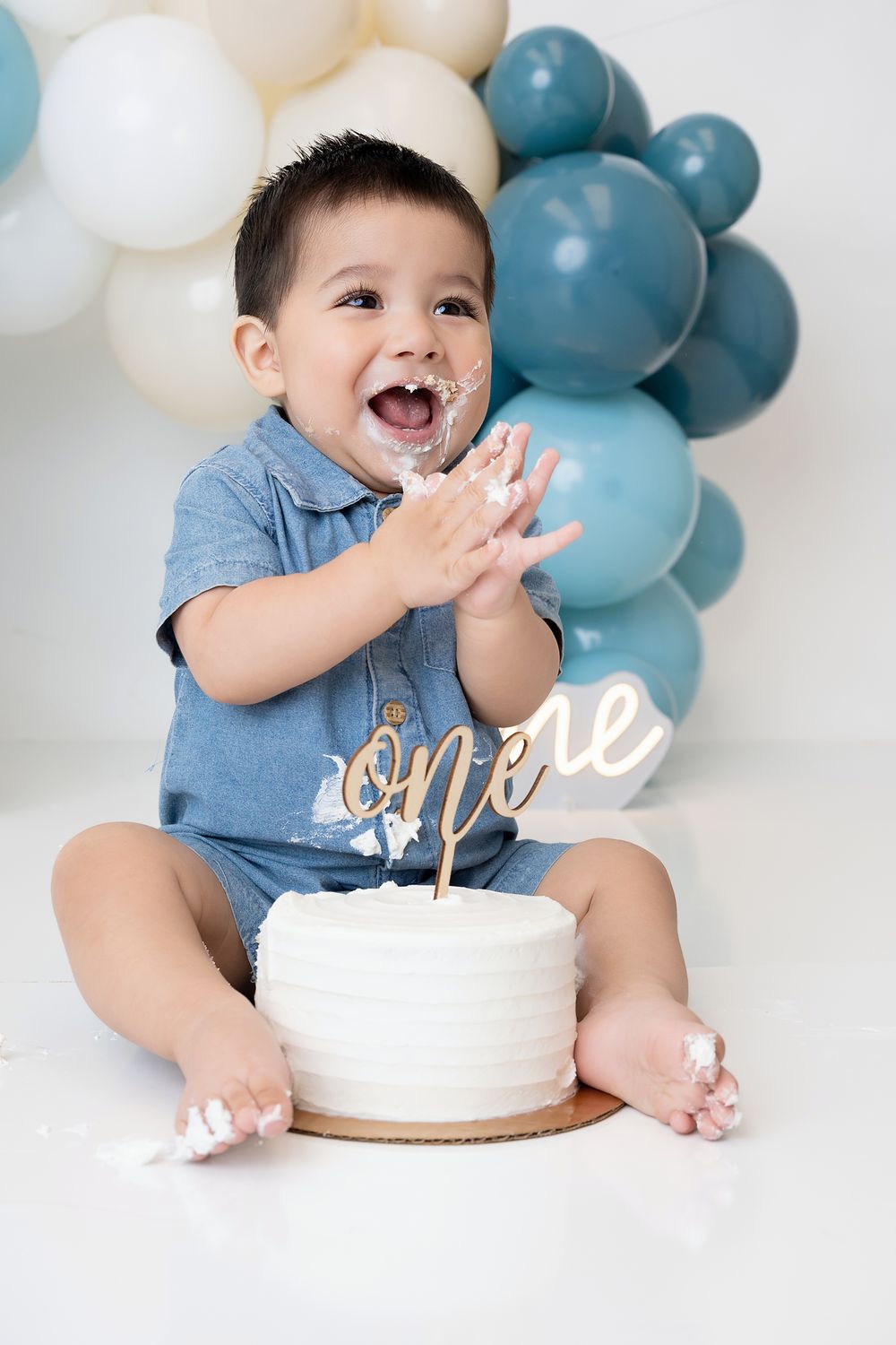 First birthday portrait with number one balloon